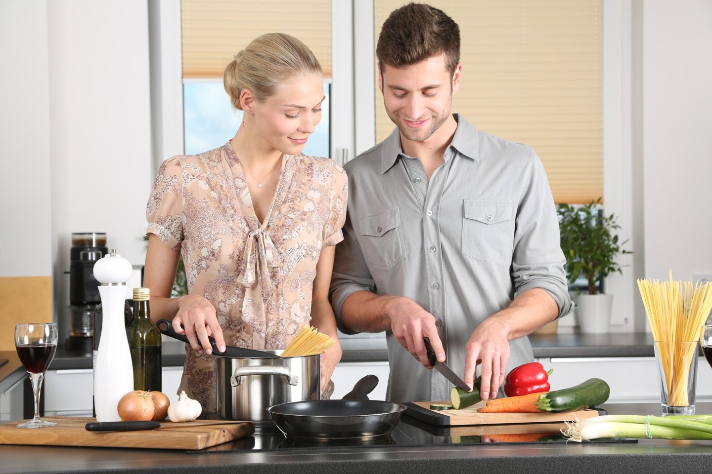 couple at home cooking together help save money