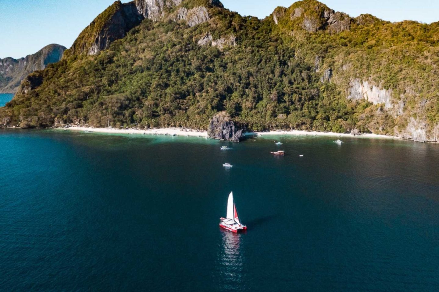 yacht in the middle of the ocean in front of 7 commando beach