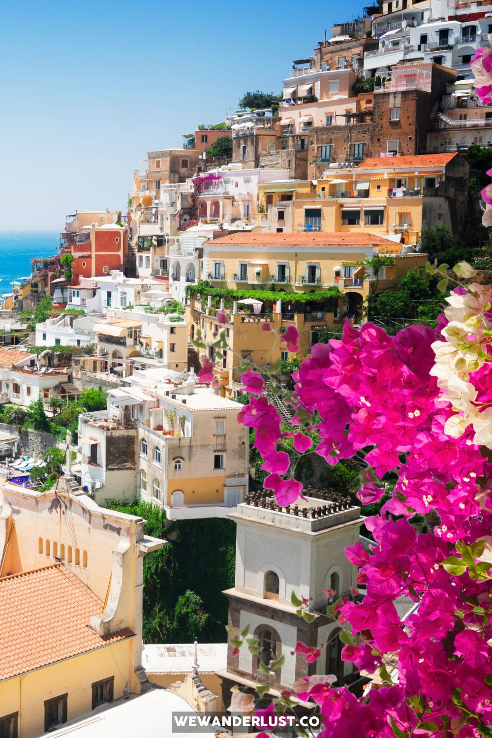 positano italy with bougainvillea in foreground