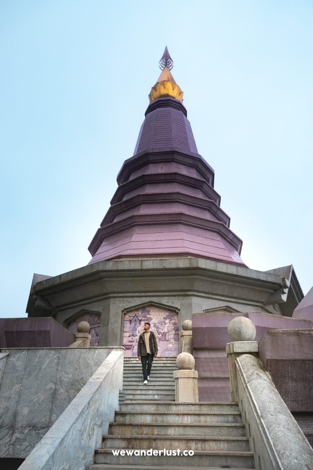 man standing by pagoda at doi inthanon pagodas in thailand