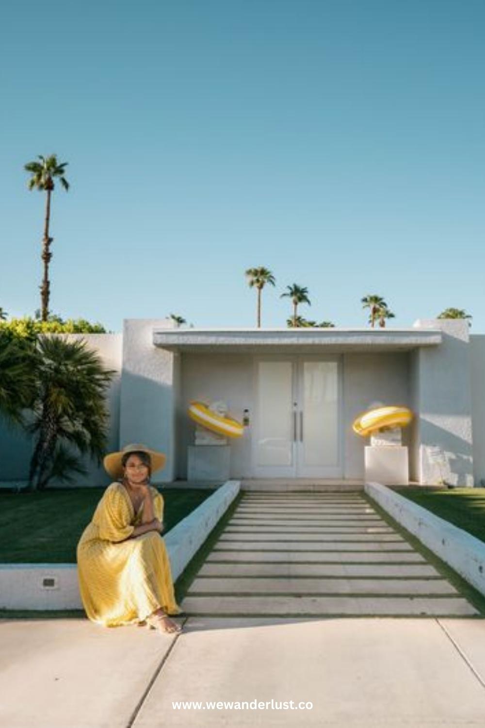 woman sitting in front of mid-century modern home in Palm Springs