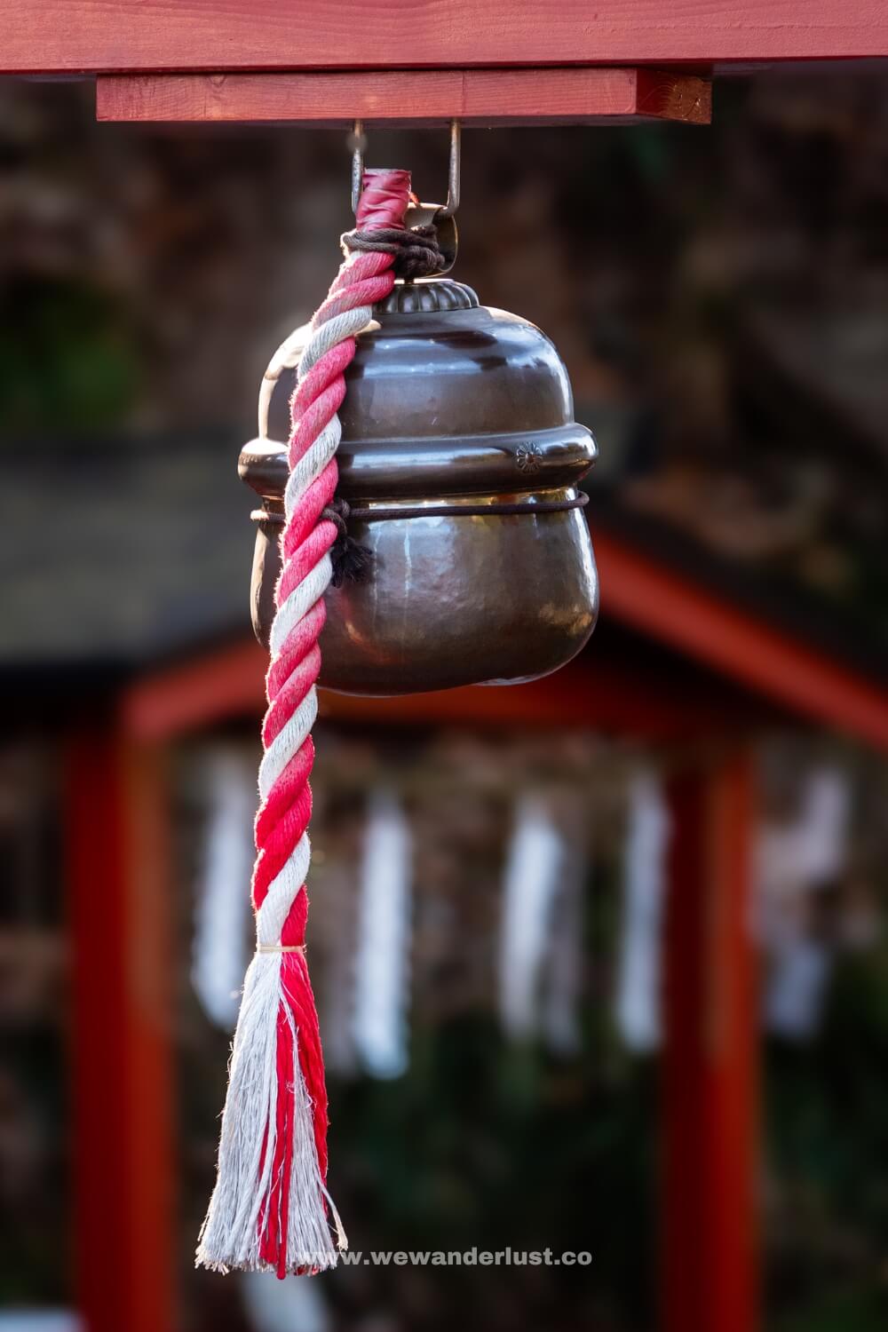 bell at entrance of shinkyo bridge in japan